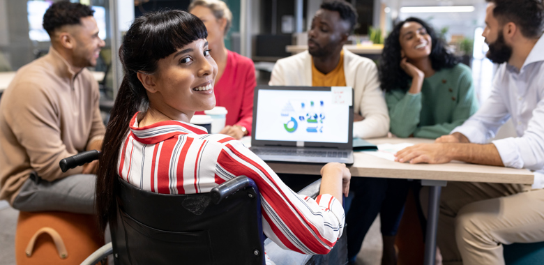 55506434 Smiling Biracial Disabled Businesswoman Looking Over