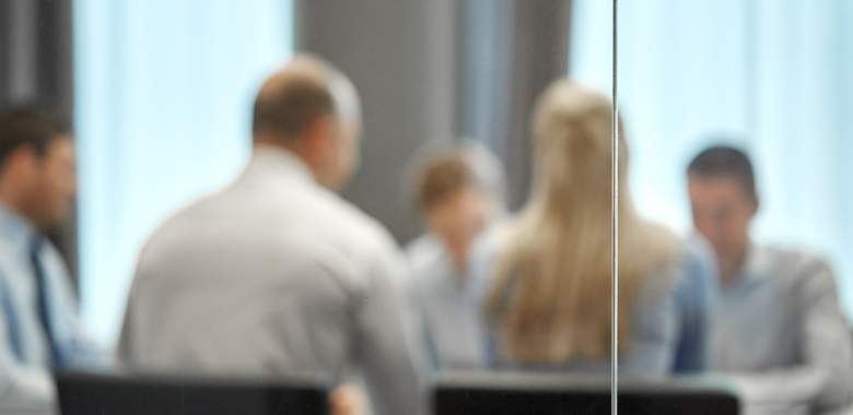 43202826 Business Team Meeting At Office Behind Glass Wall Besk